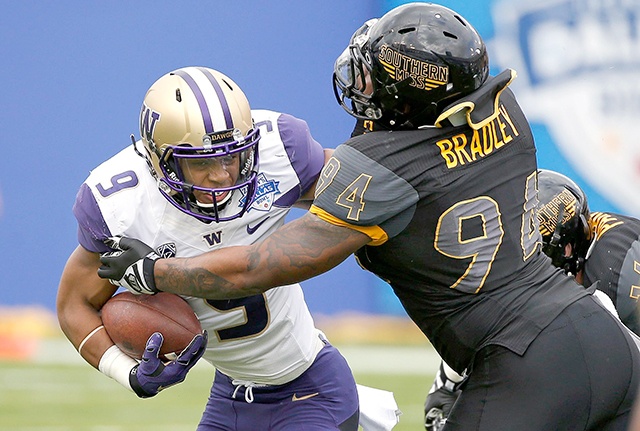 The Associated Press Washington running back Myles Gaskin (9) runs against Southern Mississippi defensive lineman Dylan Bradley (94) during the first half of the Heart of Dallas Bowl NCAA college football game Saturday, Dec. 26, 2015, in Dallas.