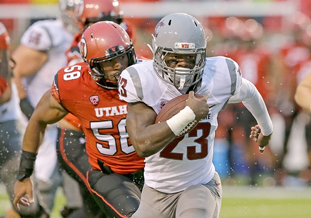 The Associated Press Washington State’s Gerard Wicks (23) is one of three Cougars running backs competing for playing time.