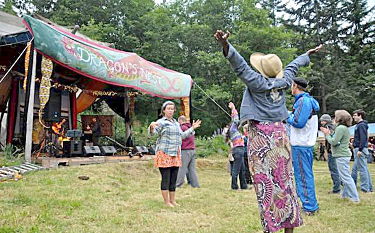 The audience enjoys a performance at a past Boomfest at the Dragon’s Nest near Port Townsend. (David M. Lindsay)