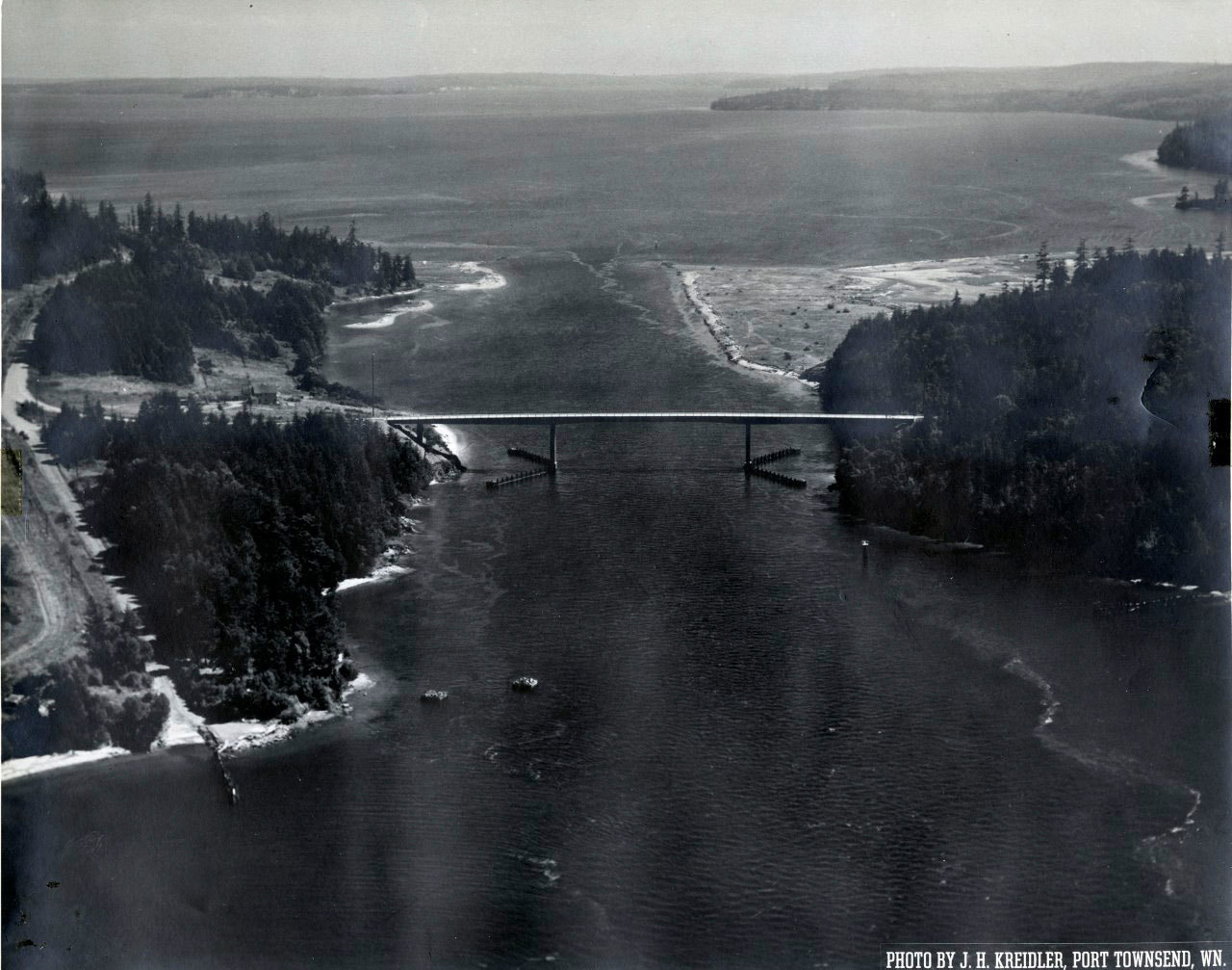 An aerial view of the Portage Canal Bridge connecting Port Hadlock on the left and Indian Island on the right. (Jefferson County Historical Society)