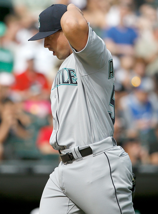 The Associated Press Seattle Mariners relief pitcher Dan Altavilla reacts as he walks to the dugout after the eighth inning of a baseball game against the Chicago White Sox in Chicago, Sunday.