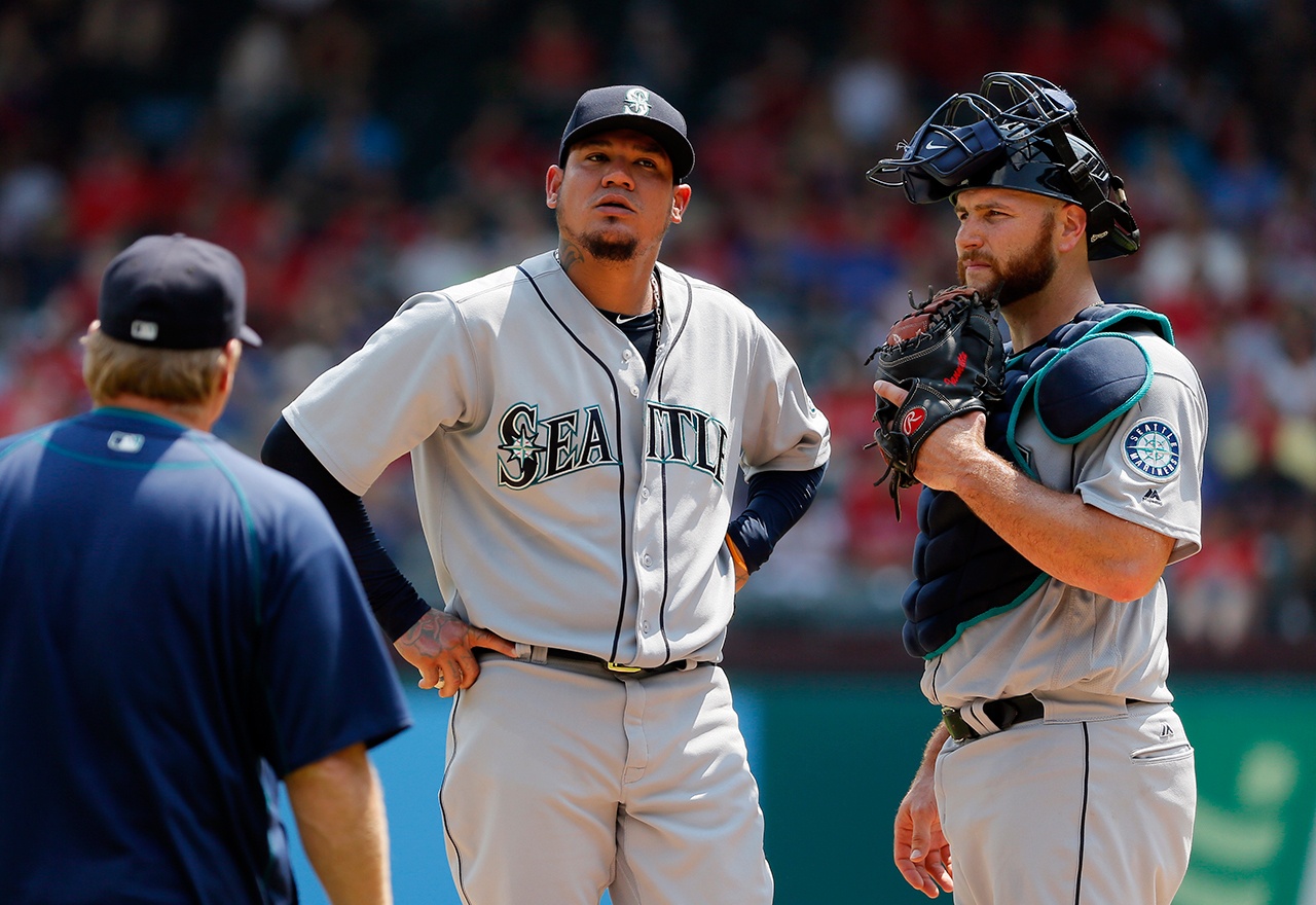 The Associated Press Seattle Mariners pitching coach Mel Stottlemyre visits starting pitcher Felix Hernandez and Chris Iannetta, right, on the mound in the fourth inning of a baseball game against the Texas Rangers on Wednesday, Aug. 31, 2016, in Arlington, Texas.