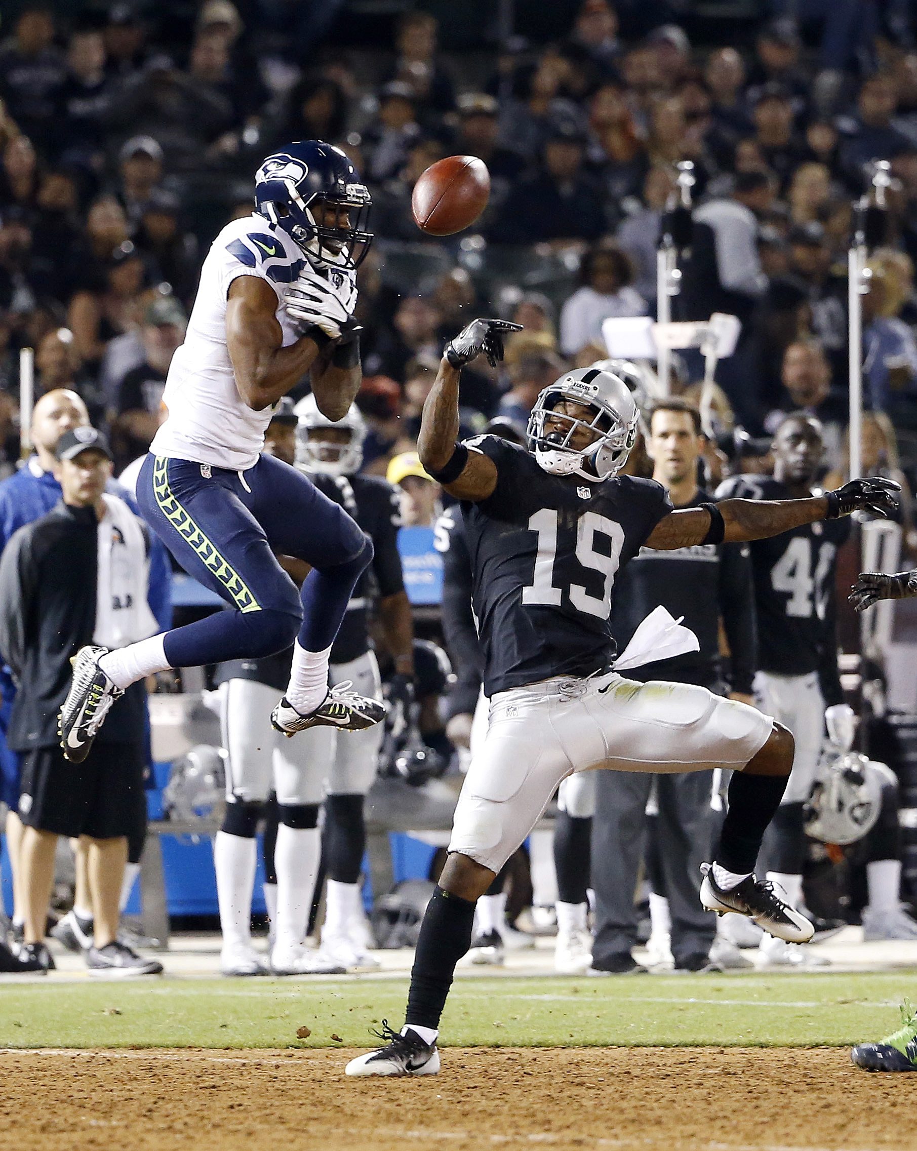 The Associated Press                                Seahawks cornerback DeAndre Elliott, left, breaks up a pass intended for Oakland wide receiver Jaydon Mickens during a preseason game.