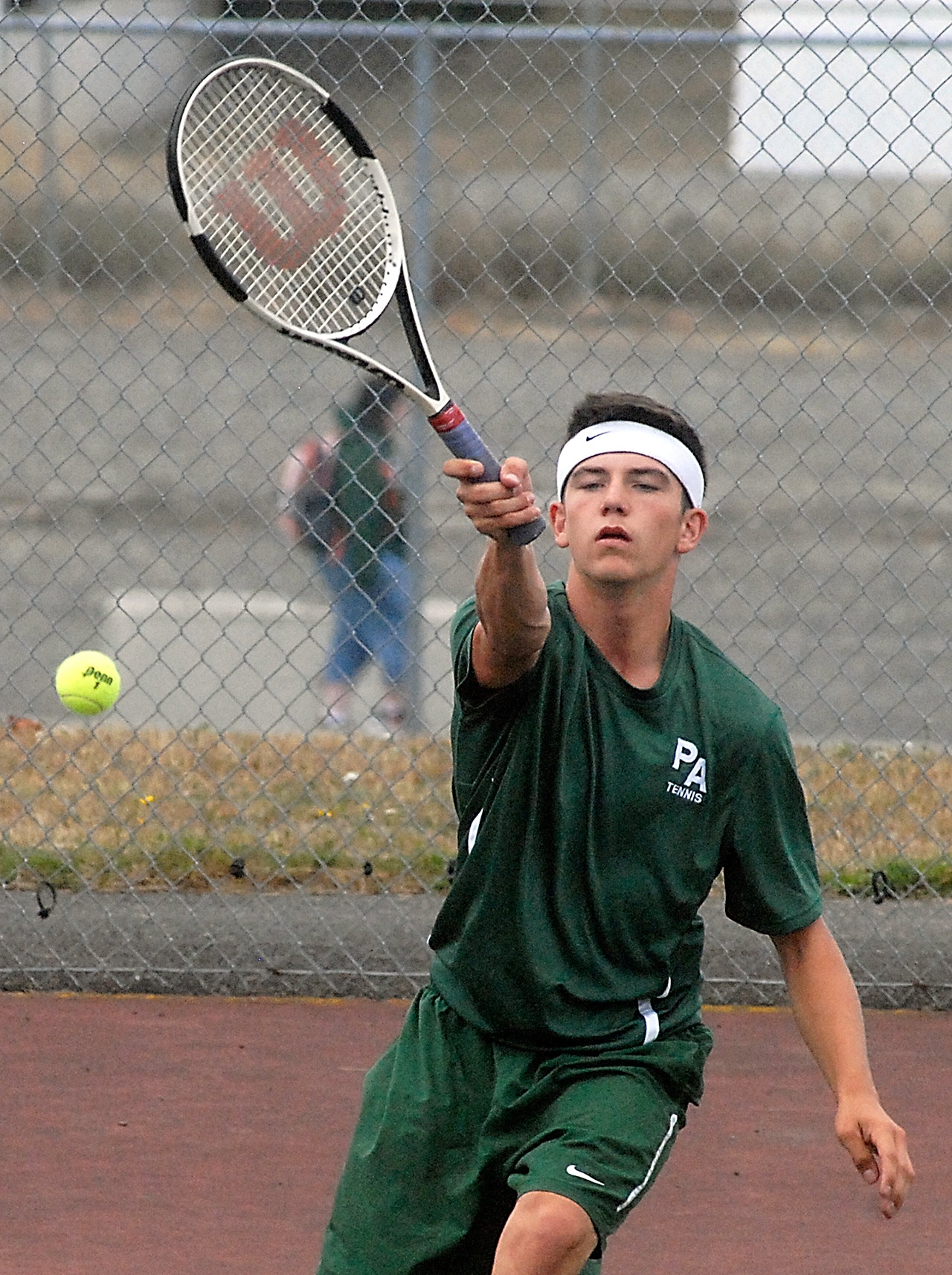 Keith Thorpe/Peninsula Daily News Kenny Soule of Port Angeles hits the return in his match against Nick Etzell of Coupeville on Tuesday at Port Angeles High School. Soule defeated Etzell in three sets and was named the player of the match by coach Gil Stockton.