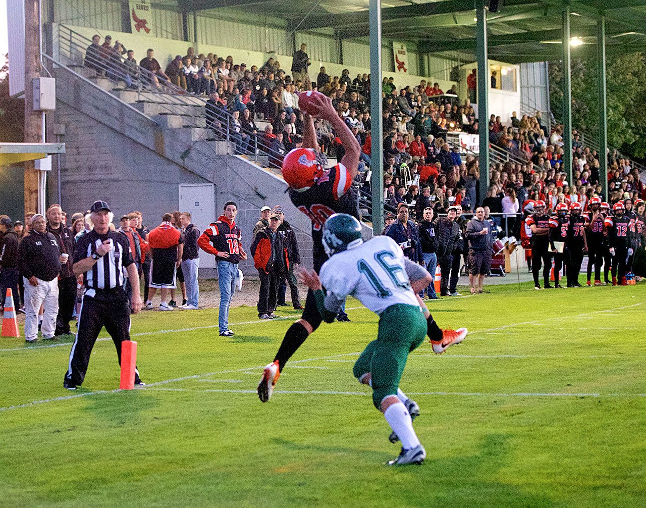 Steve Mullensky/for Peninsula Daily News Port Townsend’s Detrius Kelsall, 10, beats out Port Angeles’ Easton Joslin and makes the catch in the end zone for a 9-yard touchdown.