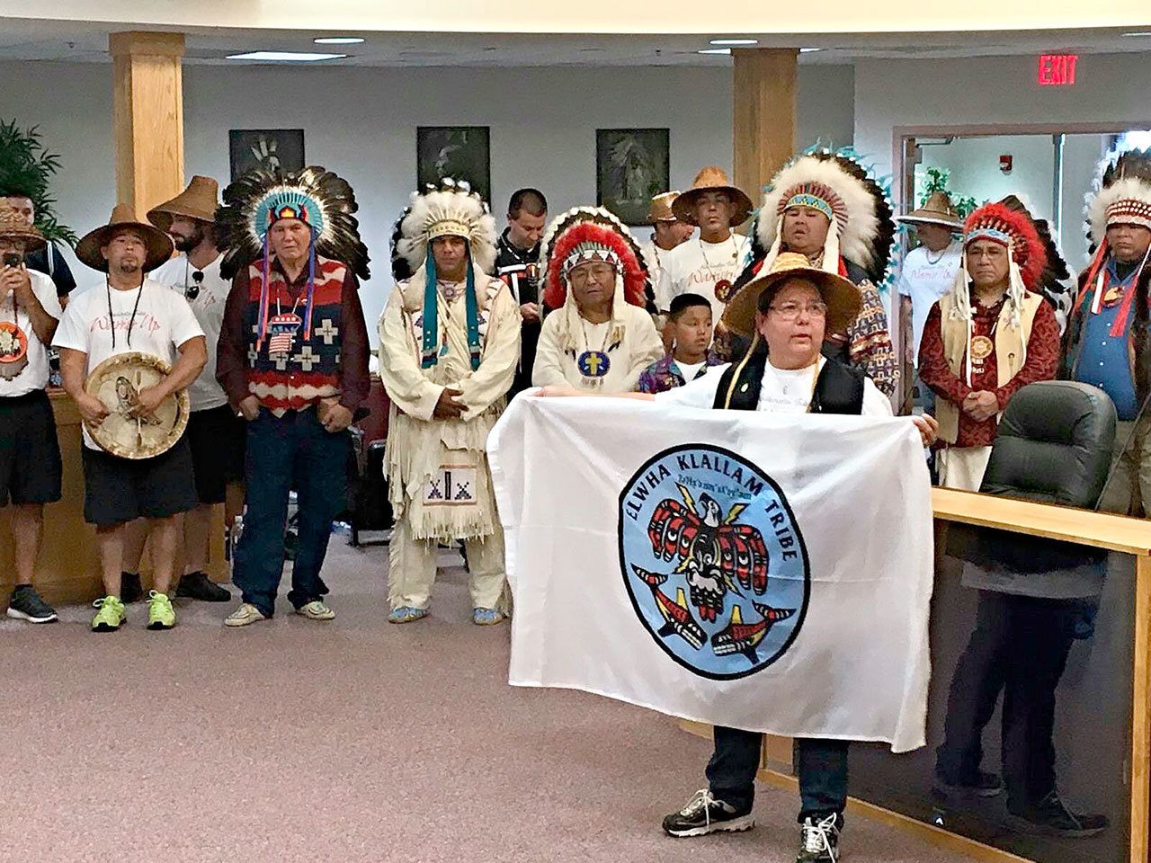 Lower Elwha Tribal Chairwoman Frances Charles displays the tribe’s flag in a presentation to the Standing Rock Sioux on Aug. 29. (Lower Elwha Tribe)