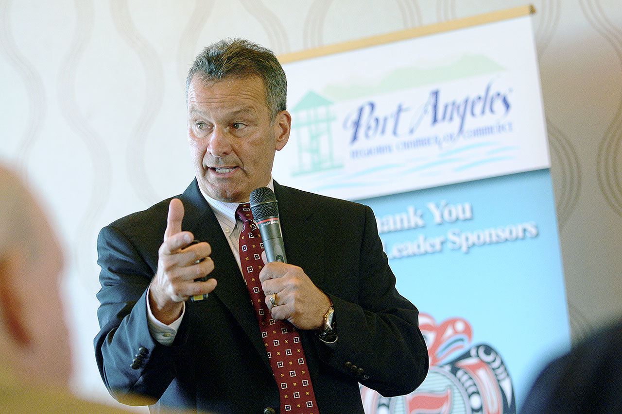 Jim Haguewood, Port Angeles Regional Chamber of Commerce board member, tells the chamber during a luncheon Wednesday details of the chamber’s five-year strategic plan. (Jesse Major/Peninsula Daily News)