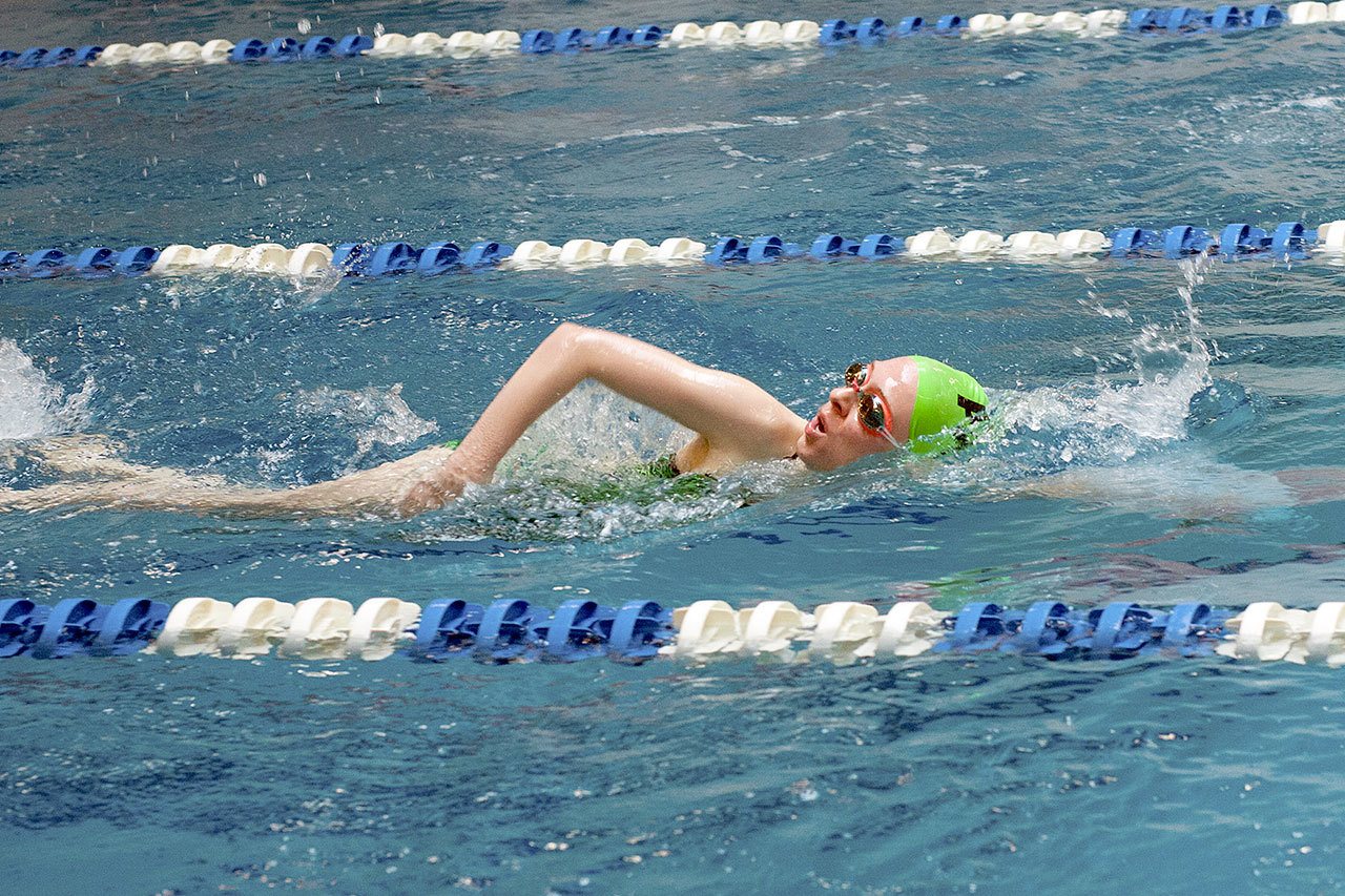 Patti Reifenstahl                                Port Angeles’ Janelle Stevenson swims freestyle in the 200-yard free relay against Klahowya.