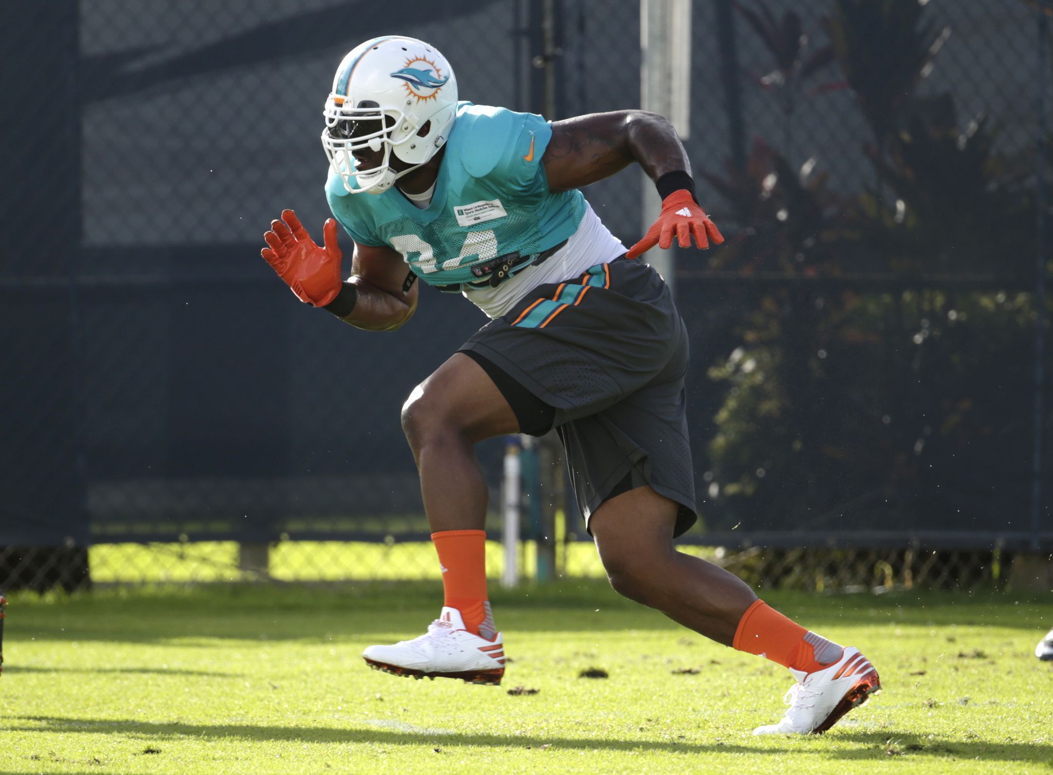 FILE - In this Aug. 15, 2016 file photo, Miami Dolphins defensive end Mario Williams runs drills, during practice at NFL football training camp in Davie, Fla. Williams makes in his debut with Miami on Sunday, Sept. 11 when the Dolphins play the the Seattle Seahawks. (AP Photo/Lynne Sladky, File)