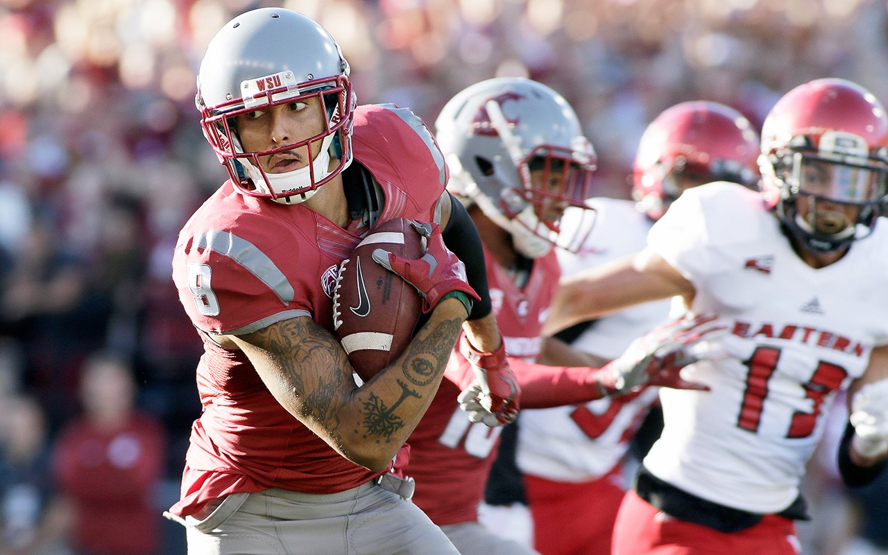 The Associated Press Washington State wide receiver Gabe Marks, 9, runs the ball for a touchdown during the first half of the Cougars’ 45-42 loss to Eastern Washington on Saturday.