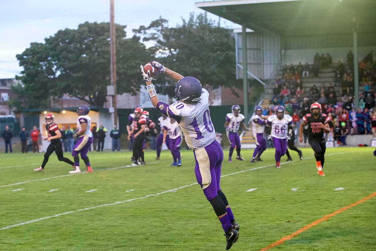 Steve Mullensky/for Peninsula Daily News Sequim’s Payton Glasser pulls in a pass during a game against Port Townsend last week at Memorial Field in Port Townsend.