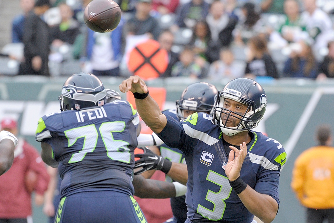 Wilson throws 3 TDs in Seahawks win