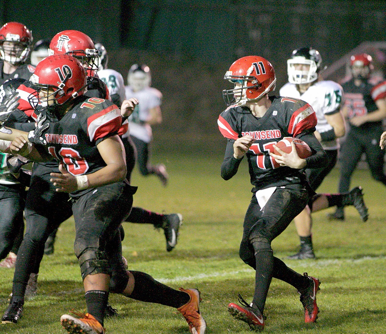 Steve Mullensky/for Peninsula Daily News Port Townsend’s Berkley Hill picks up a block and rushes for a first down in a against the Klahowya Eagles.