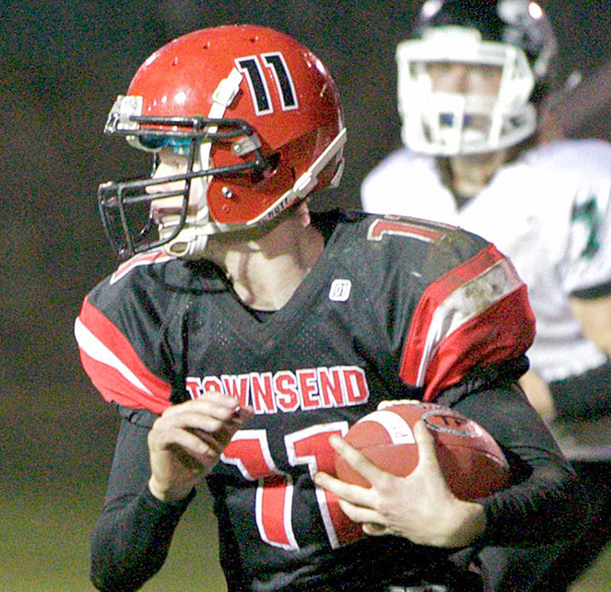 Steve Mullensky/for Peninsula Daily News                                Redhawk Berkley Hill picks up a block and rushes for a first down in a Monday night game in Port Townsend against the Klqhowya Eagles.