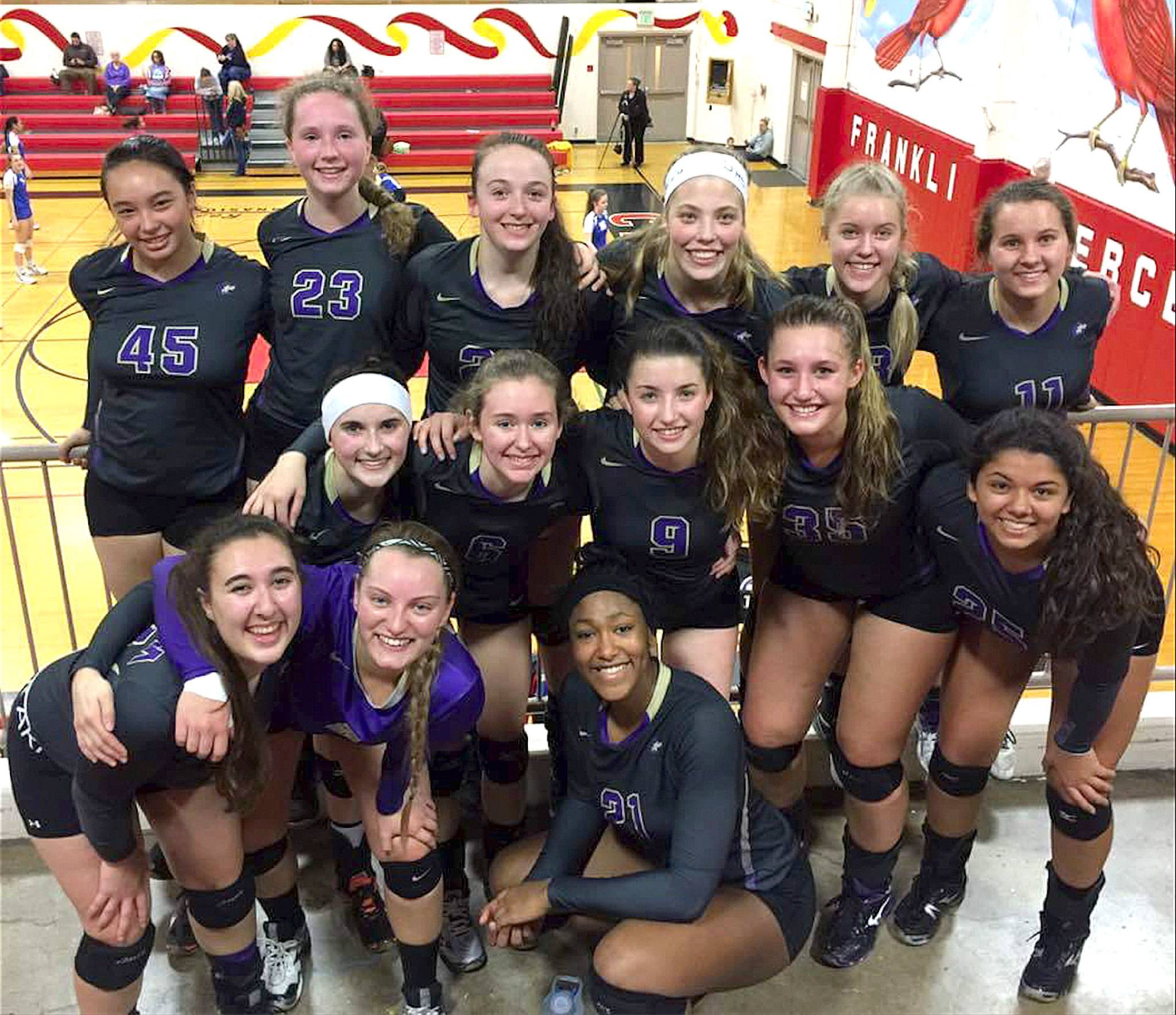 Courtesy photo                                The Sequim volleyball team celebrates Saturday night after defeating Washington High School at Districts to qualify for the State 2A Volleyball Tournament this weekend at Saint Martin’s College in Lacey. The Wolves’ first state tourney match will be at 11 a.m. Friday against ArRchbishop Murphy. From left, rear, are Lindsey Leader, Arlene Law, Tayler Breckenridge, Ella Christiansen, Annika Christensen and Alissa Loftstrom. From left, middle row, are Sydney Balkan, Brittney Gale, Maddie Potts, Jadyn Overby-Morgison and Kaila Sundquist. From left, front row, are Lillian Oden, Isabelle Dennis and Adrienne Haggerty.