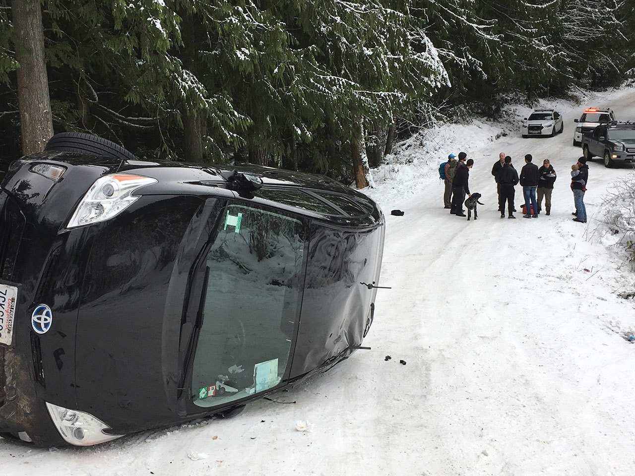 Clallam 2 Fire-Rescue responded to a vehicle accident at 1:34 p.m. Sunday about 1/4-mile up Little River Road off of Black Diamon Road. There, a 2013 Toyota Prius driven by college students from Santa Barbara, Calif., had slid into a ditch and then flipped onto its side. (Clallam 2 Fire-Rescue)