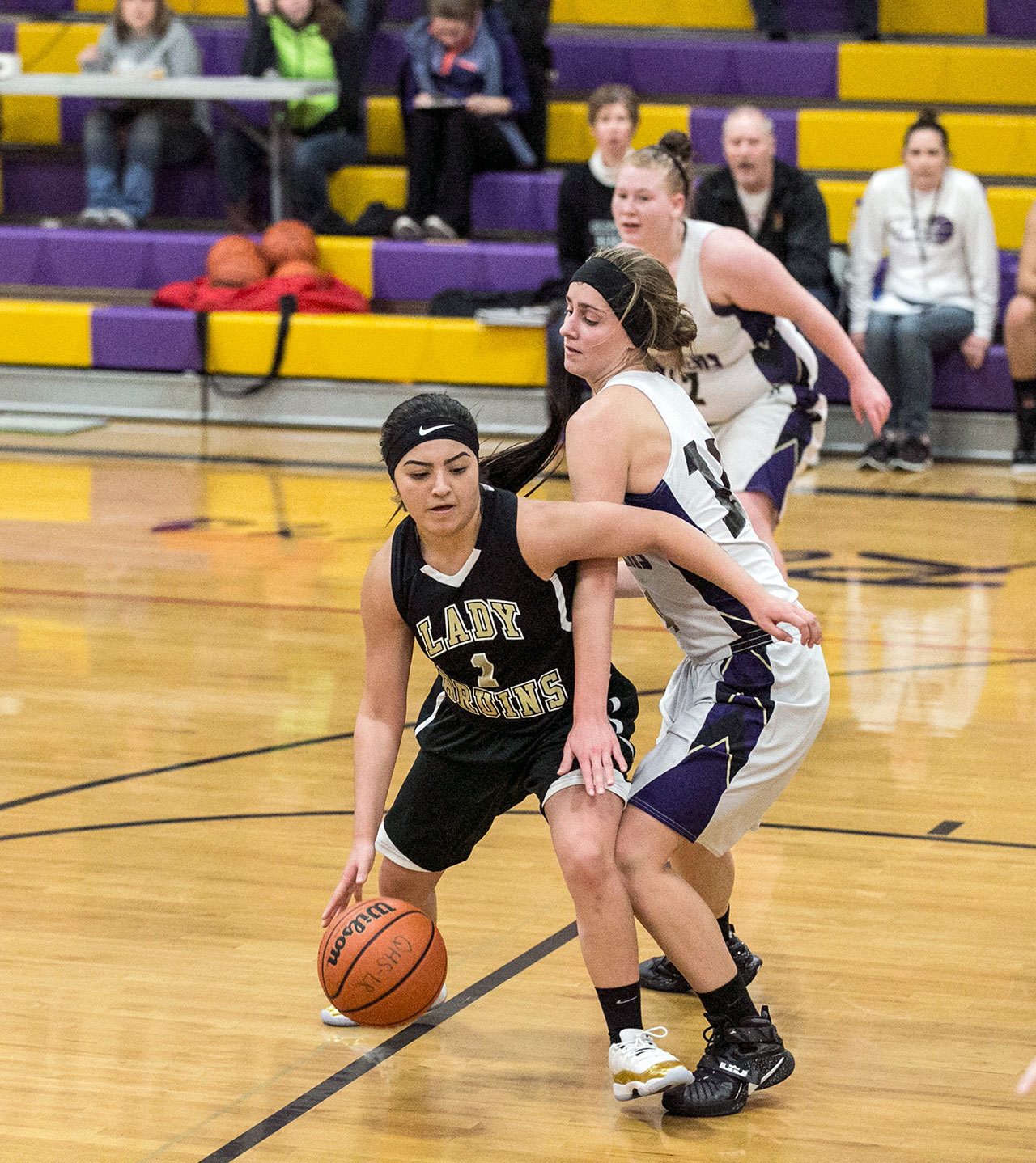 Steve Mullensky/for Peninsula Daily News                                Clallam Bay’s Mariah LaChester, left, drives around the tight defense ofQuilcene’s Katie Love during the Rangers’ 45-30 nonleague win over the Bruins.