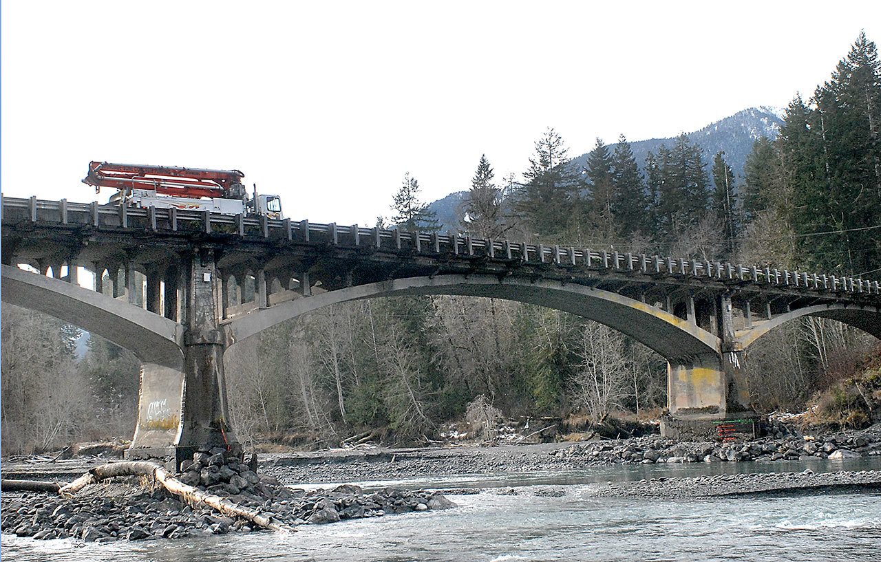 The Elwha River flows beneath the U.S. Highway 101 bridge west of Port Angeles on Wednesday as the state considers plans for replacing the aging structure. (Keith Thorpe/Peninsula Daily News)