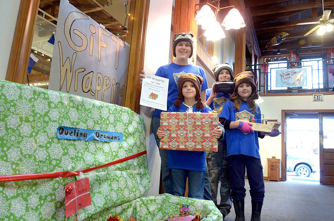 Ella Ashford, Everest Ashford, Hayden Erickson and Timber Cochron are just a few of the S.T.E.A.M team students who will be wrapping presents at Flagship Landing to raise money for their underwater robotics team. (Cydney McFarland/Peninsula Daily News)