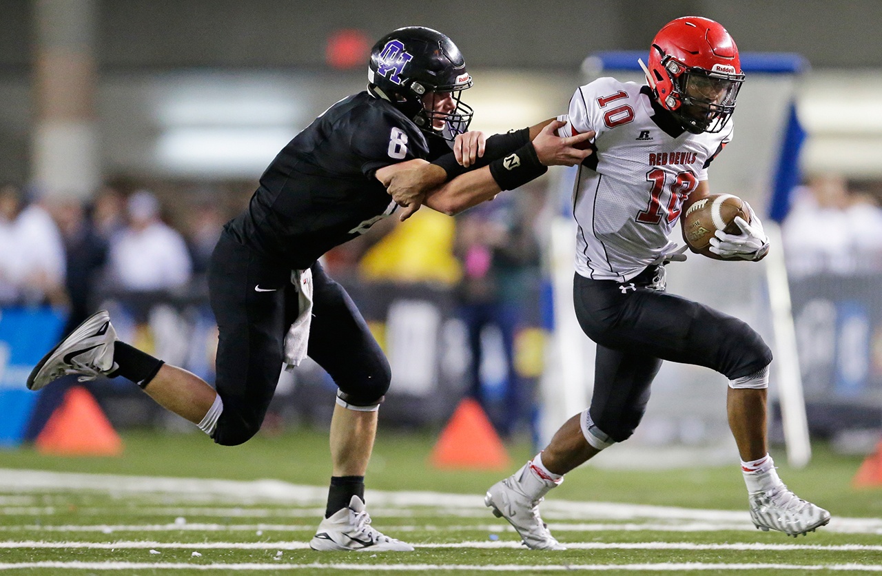 The Associated Press Neah Bay quarterback Rwehabura Munyagi Jr. , right, has been voted the Class 1B state player of the year by The Associated Press.