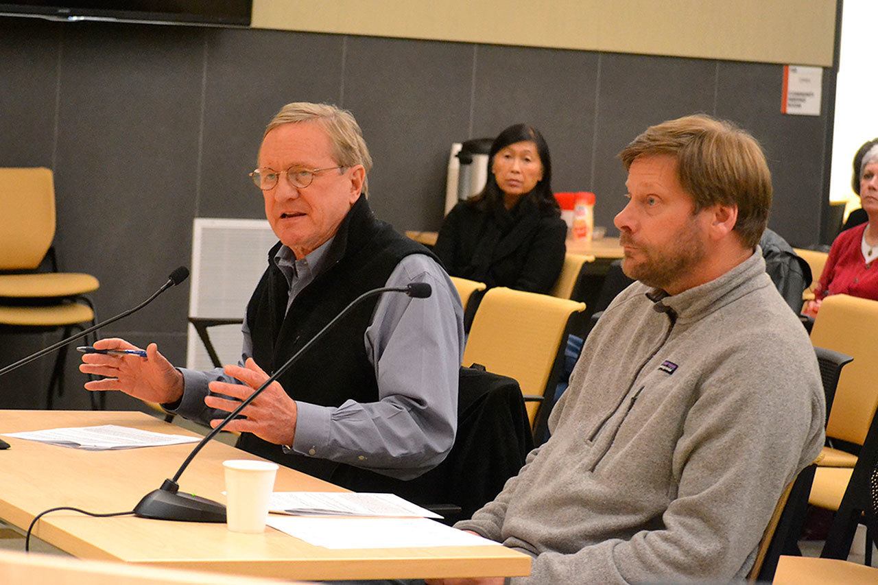 Steve Tharinger, left, and Mike Chapman, state representatives for the 24th District, speak with the Sequim City Council on Monday about the city’s legislative priorities, which include funding the Simdars Interchange and reforming public information requests. (Matthew Nash/Olympic Peninsula News Group)