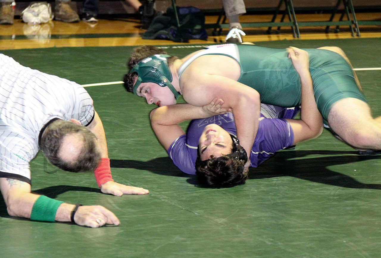 Dave Logan/for the Peninsula Daily News                                Port Angeles’ 220-pound Mason Coppage has position on his North Kitsap opponent Josh Snider. Coppage won by a pin.