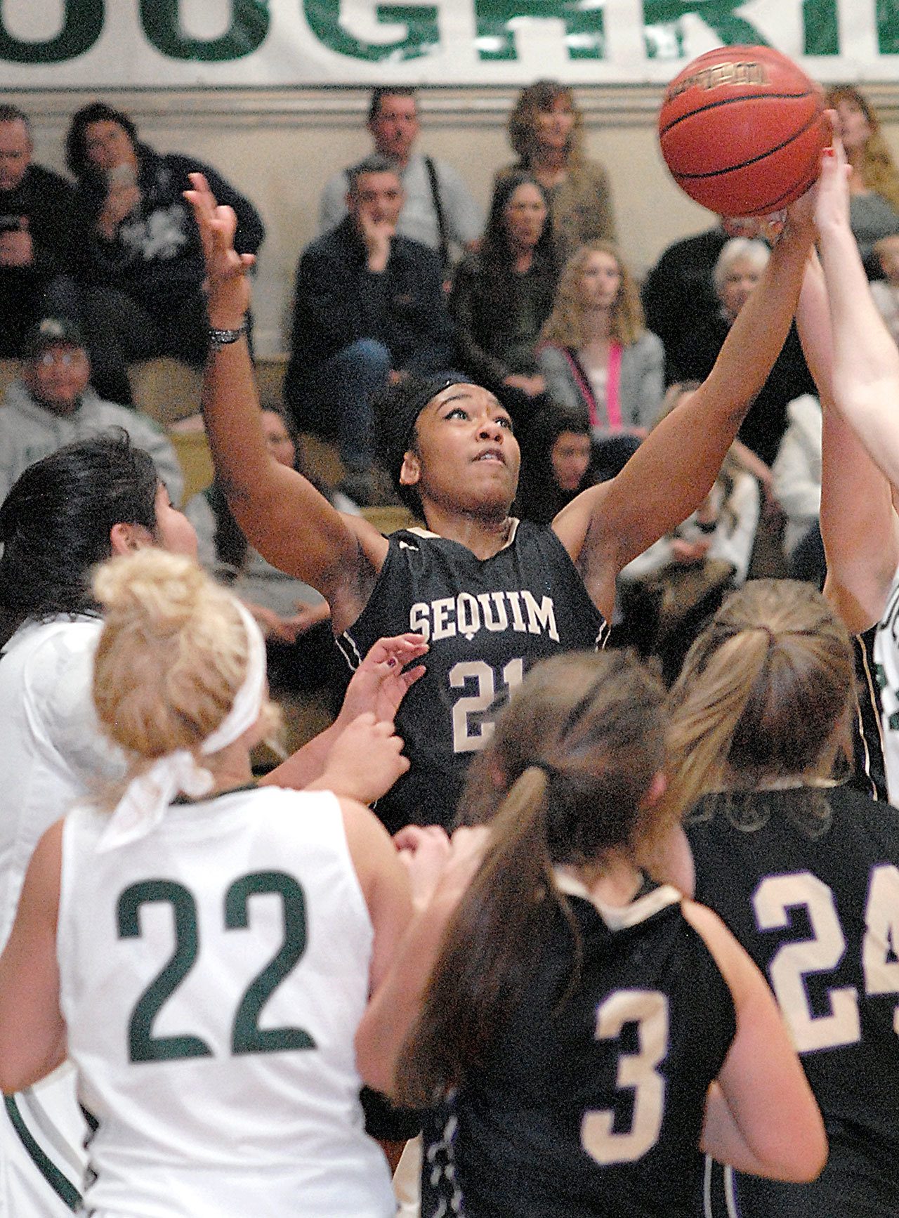 Keith Thorpe/Peninsula Daily News Sequim’s Adrienne Haggerty, top, pulls down a rebound in the fourth quarter on Friday while surrounded by, from left, Nizhoni Wheeler and Natalie Steinman of Port Angeles and teammates Bobbi Sparks and Madison Green.