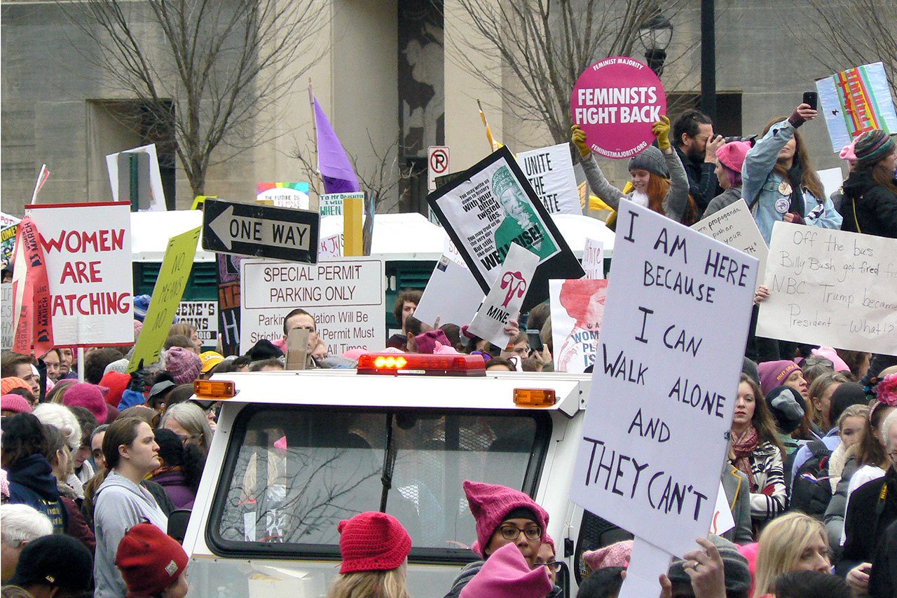 This view near the main stage at Third and Independence in Washington, D.C., offers some sense of how tightly packed the crowds were at the Women’s March on Washington. A wide range of mostly handmade signs, from serious to angry to tongue in cheek, were on display throughout the march. At the end of the day, many marchers hung their signs on railings near the White House. (Libby Wennstrom/for Peninsula Daily News)