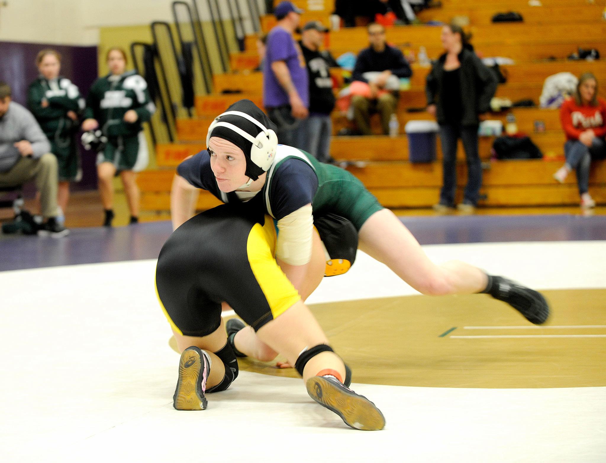 Matthew Nash/Olympic Peninsula News Group                                Port Angeles’ Alyssa Sweet at 130 pounds works her way to a pin over Lincoln’s Kayla Hoy in 3:05 of her match Saturday at SequimHigh School during the 2A District C sub-regional girls wrestling tournament.