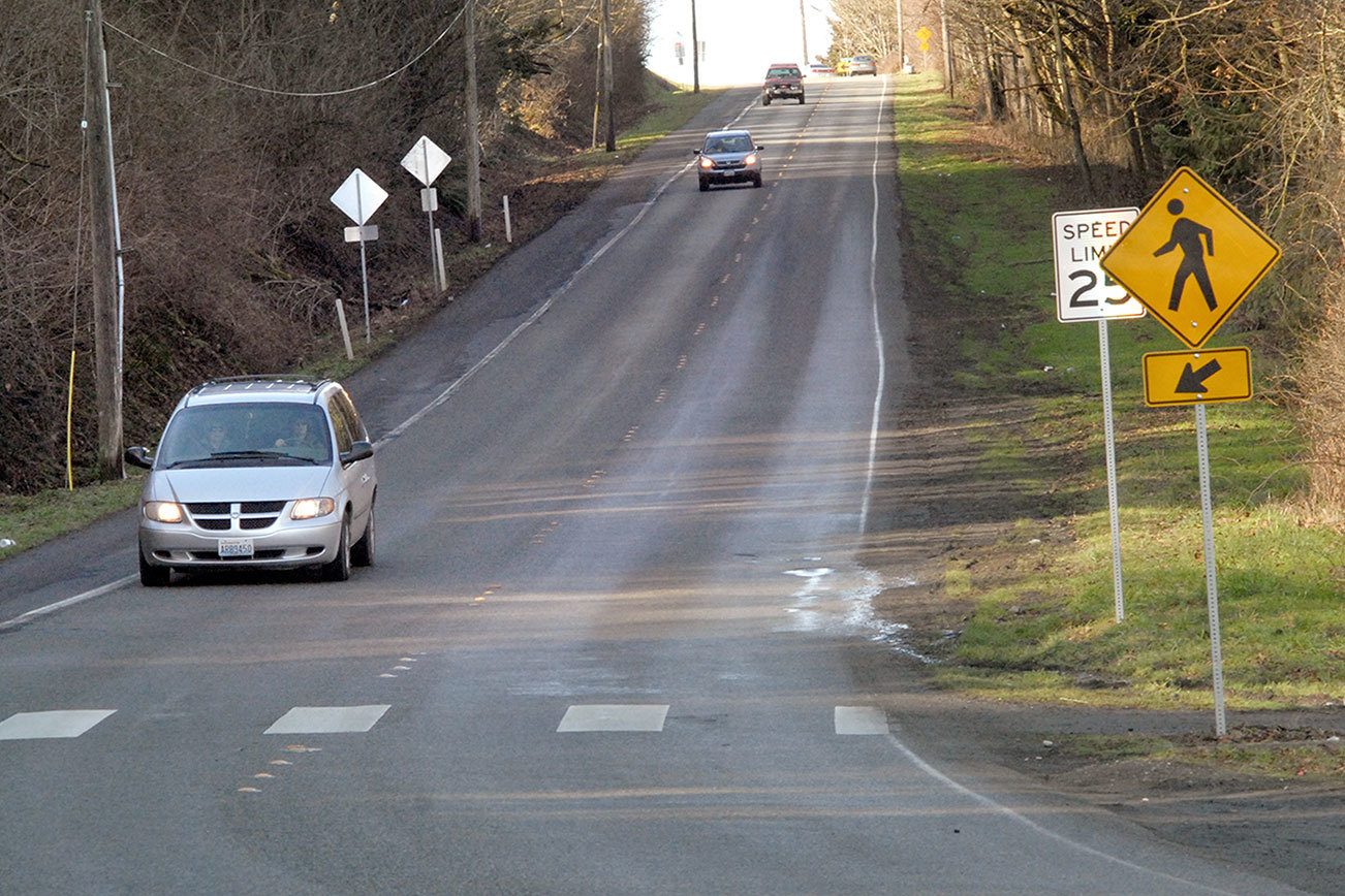 Keith Thorpe/Peninsula Daily News Vehicular traffic makes its way down Hill Street in Port Angeles, sharing the road with a connecting link of the Olympic Discovery Trail, designated as the shoulder of the roadway.