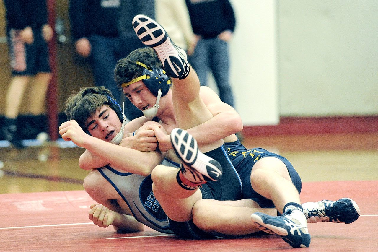 Lonnie Archibald/for Peninsula Daily News Forks’ Brett Moody defeated Nathan Aguirre of Belleview Christian in the 160 lb. class during the Regional Wrestling 1A tournament held in Hoquiam last Saturday. Moody will compete at Mat Classic XXIX today in the Tacoma Dome.