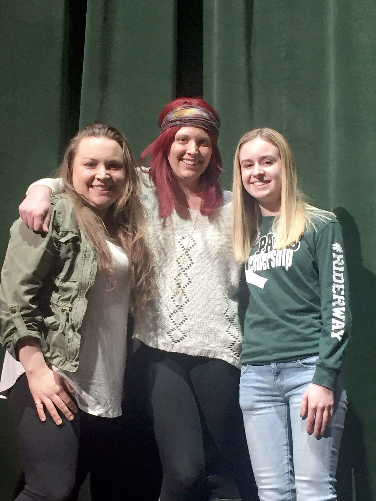 Brandy Christian, center, stands with her friend Stacia Camp, left, and Haley Locke. The eighth annual Benefit & Talent Show tonight at Port Angeles High School will benefit Christian, who was recently diagnosed with ovarian cancer.