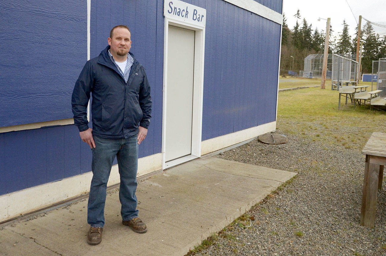 East Jefferson Little League director Kenny Yingling stands outside the league’s snack shop, which was broken into twice in December. Yingling and community members have been able to clean up most of the mess in time for baseball season. (Cydney McFarland/Peninsula Daily News)