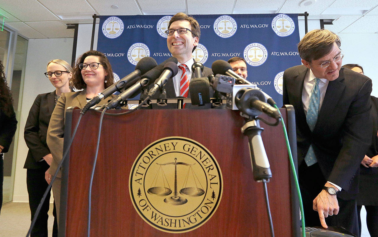 Washington State Attorney General Bob Ferguson smiles during a news conference Monday in Seattle about President Trump’s new executive order. Trump signed an executive order Monday ordering new travel restrictions for residents of six Muslim-majority countries as well as a temporary ban on refugees from around the world, retooling a directive issued five weeks ago that stoked chaos at airports and drew international condemnation and a rebuke in the federal courts. The new ban, which takes effect March 16, halts travel for 90 days for residents of Iran, Libya, Somalia, Sudan, Syria and Yemen. (Elaine Thompson/The Associated Press)