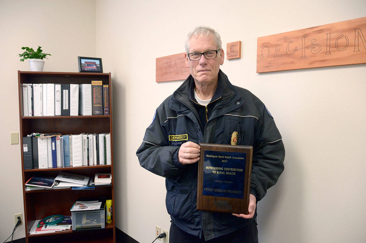 East Jefferson Fire-Rescue Chief Gordon Pomeroy was honored for his work with Jefferson Healthcare on responding to patients that have gone into cardiac arrest. (Cydney McFarland/Peninsula Daily News)