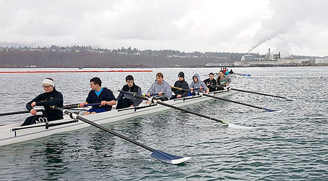 Olympic Peninsula Rowing Association Olympic Peninsula Rowing Association youth members practice on the waters of Port Angeles Harbor. The growing club seeks funds to purchase a more modern racing shell. Association members are, from left, Maria England, Aidan Feingold, Elliott Hill, Jake McGovern, Zachary Gavin, Adam Boyd, Ella Ventura and Lisa Callahan. Coxswain Victoria Kennedy is just out of frame.