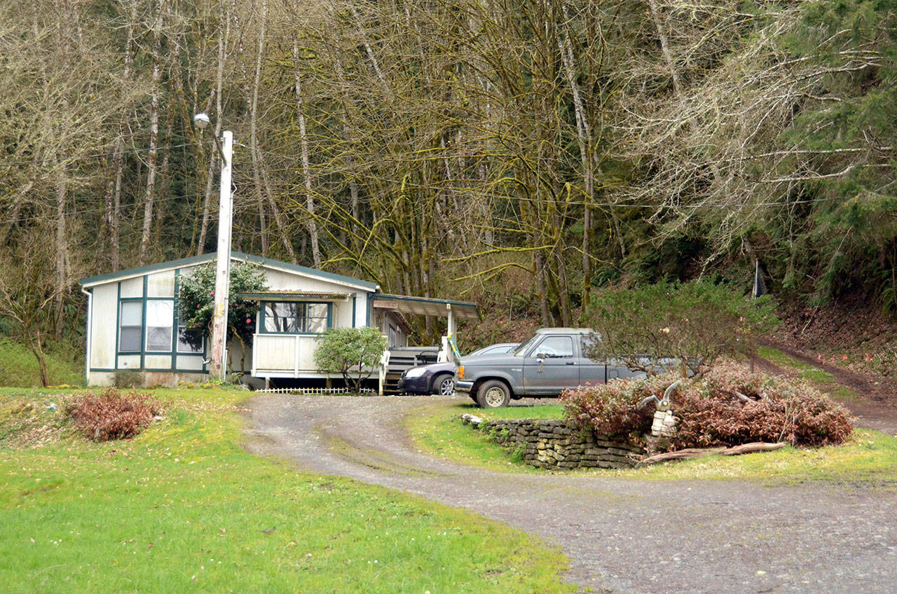 The caretaker residence at Quilcene’s Herb Beck Marina will need to be moved due to landslide and flooding risks. (Cydney McFarland/Peninsula Daily News)