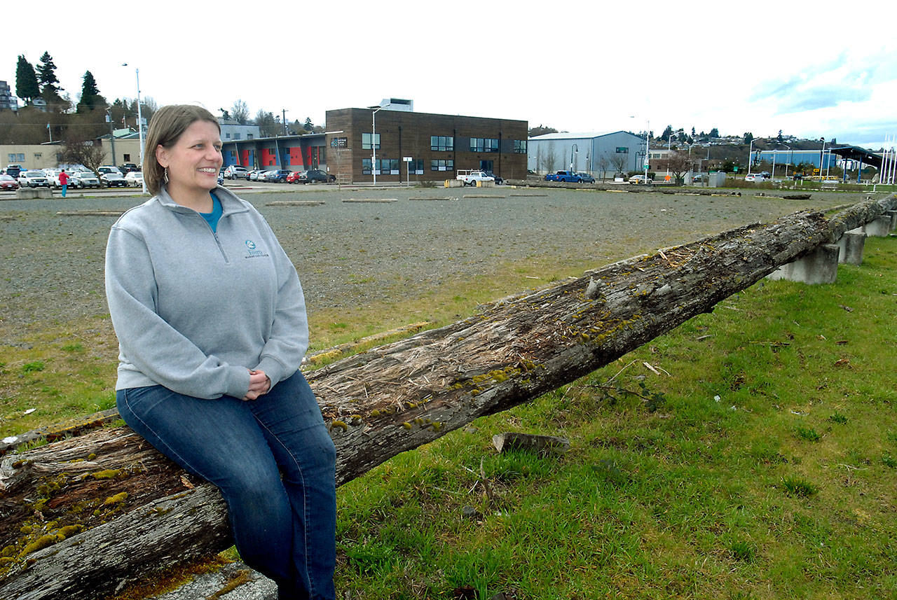 Melissa Williams, executive director of the Feiro Marine Life Center, visits the site of the proposed Port Angeles Waterfront Center near Front and Oak streets in downtown Port Angeles on Wednesday. The site is being considered for a replacement of the current marine life center at Port Angeles City Pier. (Keith Thorpe/Peninsula Daily News)