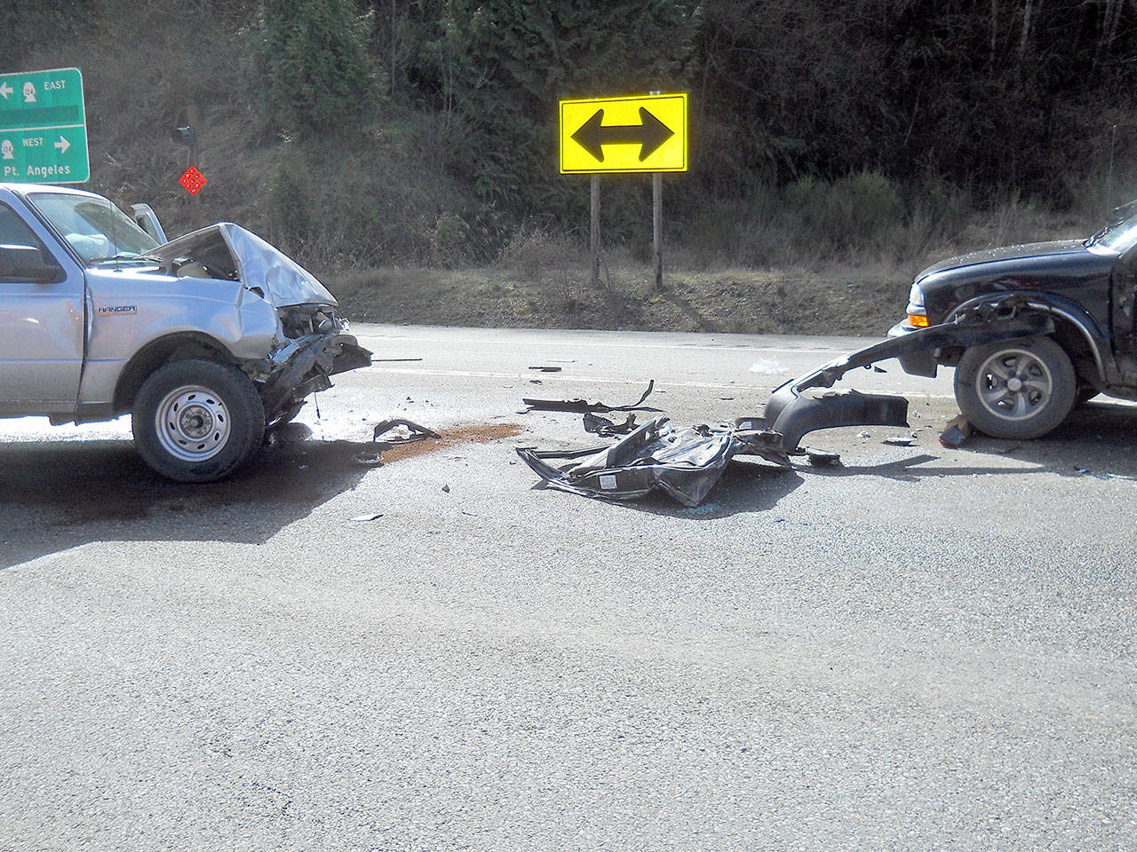 Two pickup trucks collided at the intersection of highways 104 and 19 Friday morning, blocking both lanes and injuring both drivers. (Port Ludlow Fire & Rescue)