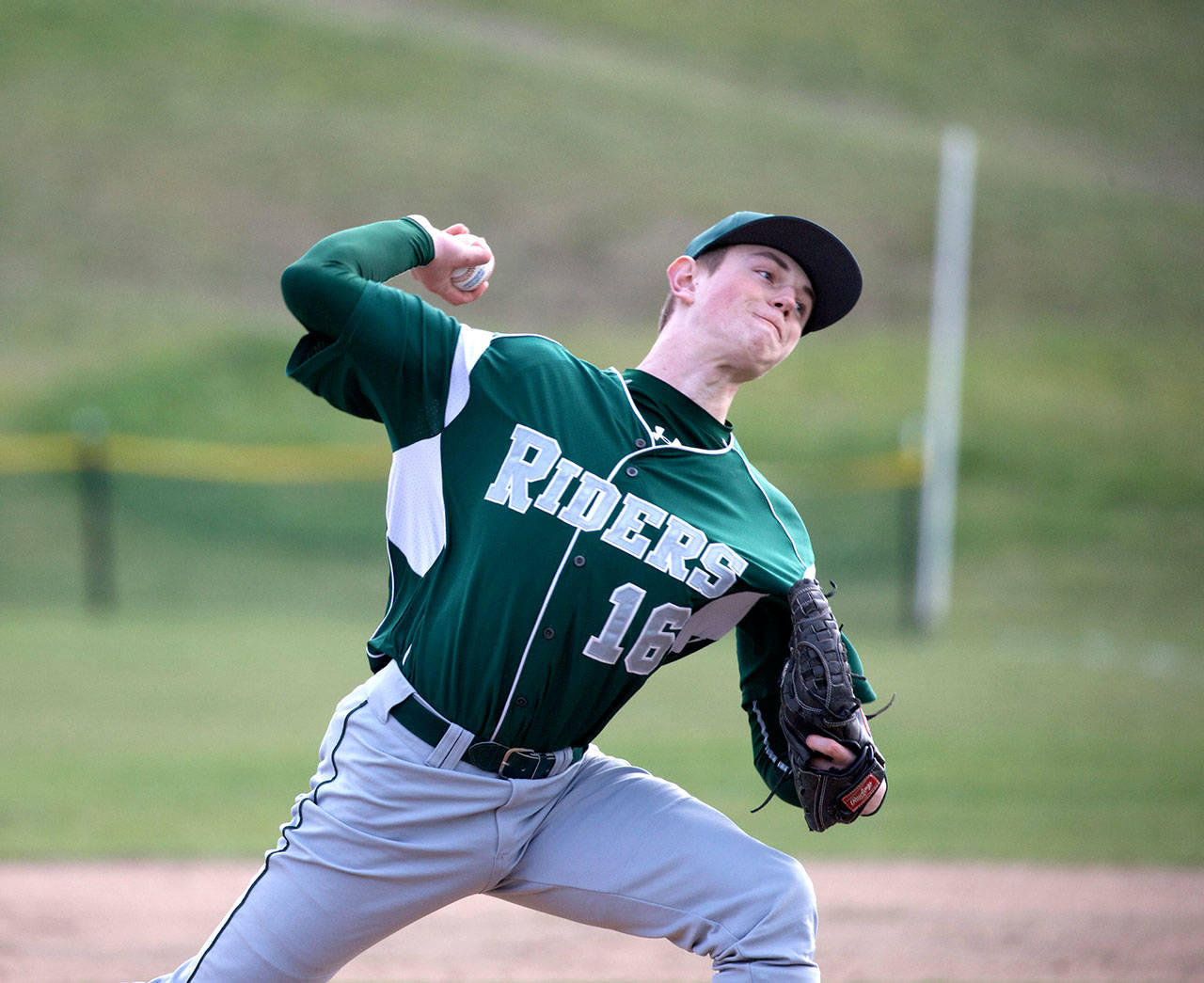 Steve Mullensky/for Peninsula Daily News                                Port Angeles pitcher Ethan Flodstrom pitches during a game against Port Townsend on Monday. Flodstrom, Brady Shimko and Andrew Pena combined to throw a perfect game in a 12-0 win over the Redhawks.