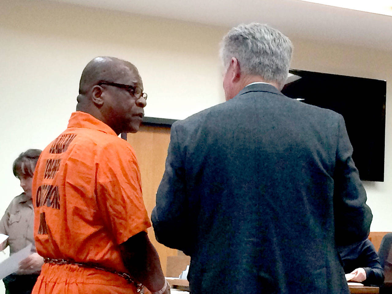 Murder suspect Tommy Ross consults with his attorney, Lane Wolfley of Port Angeles, during a court hearing Tuesday. (Paul Gottlieb/Peninsula Daily News)