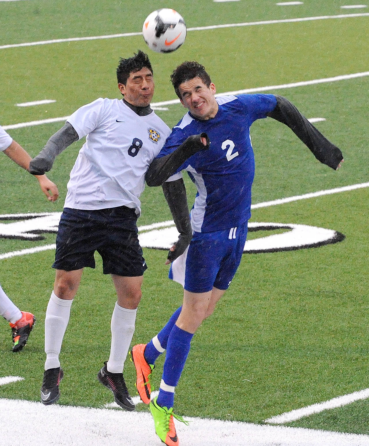 Lonnie Archibald/for Peninsula Daily News                                Forks’ Luis Pedro Tomas, left, and Elma’s Avery Brown vie for the ball during an Evergreen League 1A game at Spartan Stadium. The Eagles topped the Spartans 2-1.