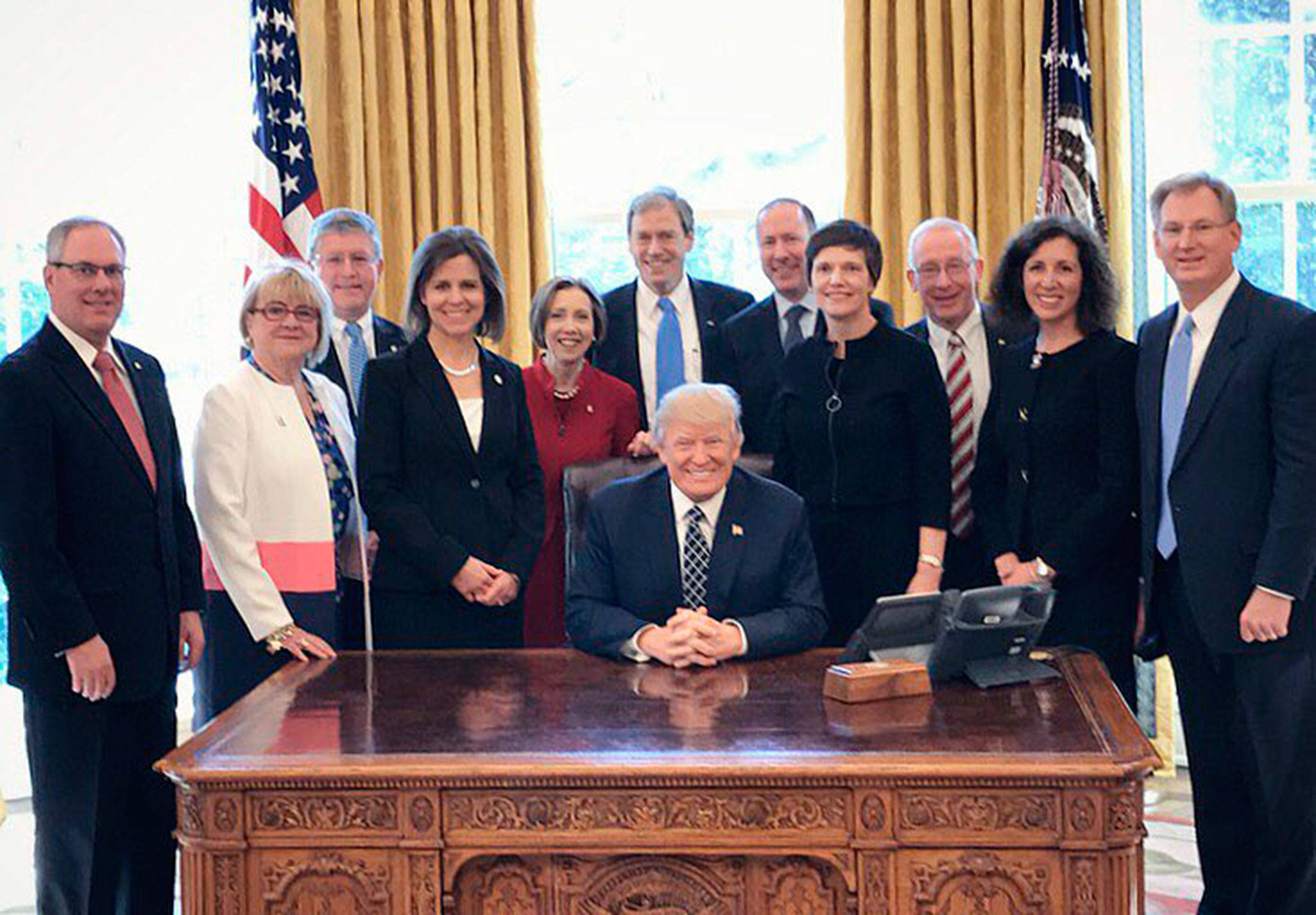 Sound Community Bank President/CEO Laurie Stewart, second from left, joins other community bank representatives at the White House on March 9.