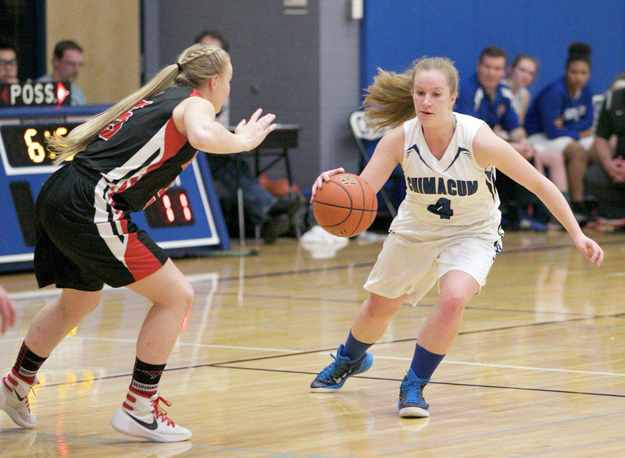 Steve Mullensky/for Peninsula Daily News Chimacum’s Mechelle Nisbet, right, dribbles around the defense of Port Townsend’s Kaitlyn Meek. Nisbet has been voted the All-Peninsula Girls Basketball MVP by coaches and the sports staff of the Peninsula Daily News.