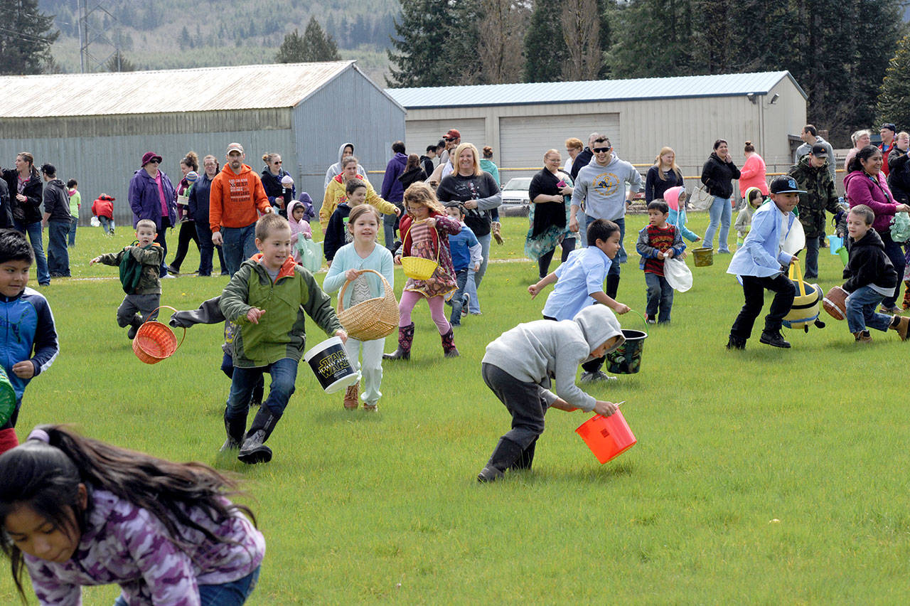 Forks children ages 4 to 8 are pictured during the annual Easter egg hunt at Tillicum Park in Forks. (Lonnie Archibald/for Peninsula Daily News)