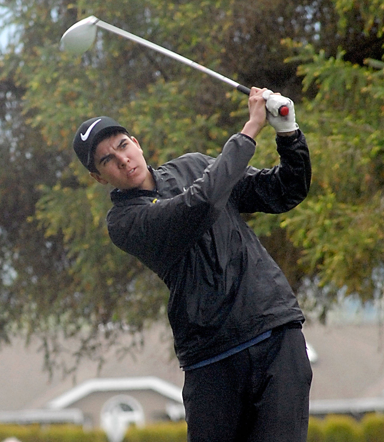 Keith Thorpe/Peninsula Daily News Blake Wiker of Sequim tees off on the 10th hole during Wednesday’s Olympic League Championship tournament at The Cedars at Dungeness golf course near Sequim.