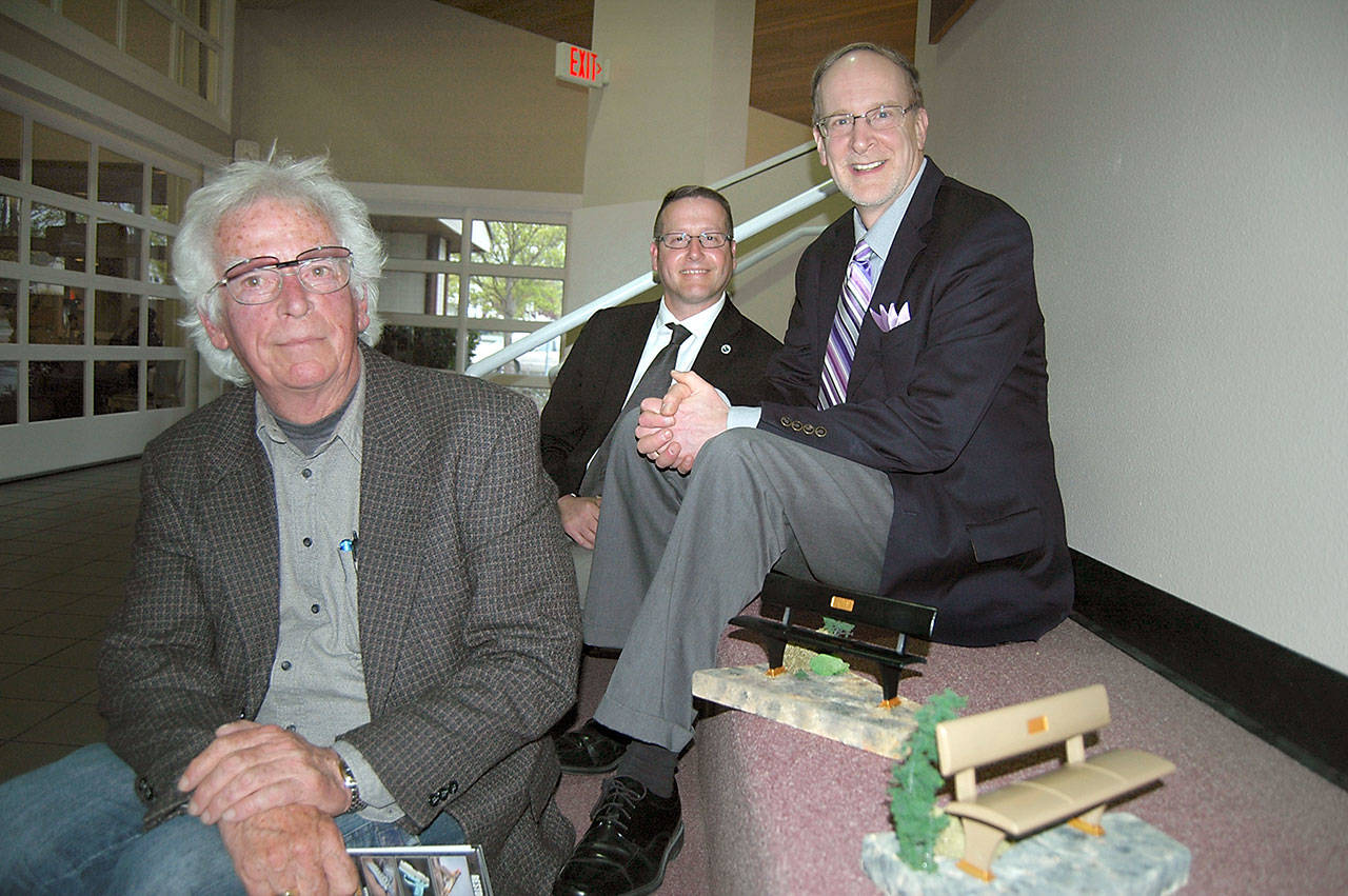 Bob Stokes, Corey Delikat and Dave Walter, from left, collaborated on a pilot project to build prototype park benches out of recycled composite plastic that was outlined last week at a Port Angeles City Council meeting. (Paul Gottlieb/Peninsula Daily News)