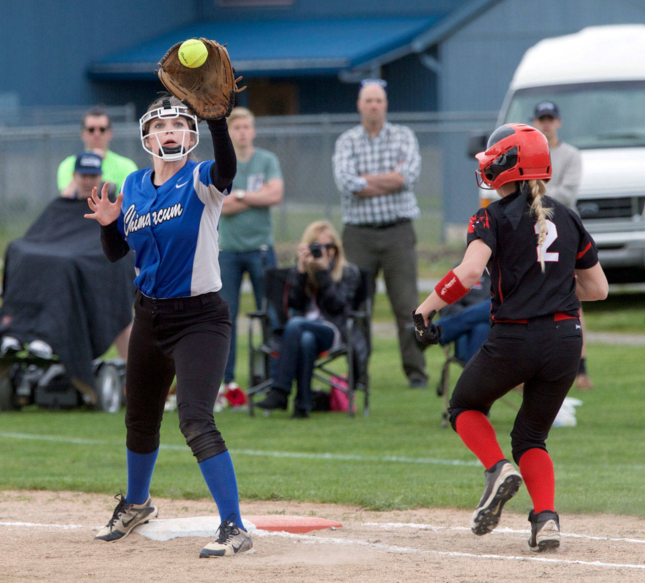 Steve Mullensky/for Peninsula Daily News                                Grace Yaley has the ball and the out at first on Coupeville’s Sarah Wright in the Cowboys’ Olympic League 1A Division-clinching win over the Wolves.