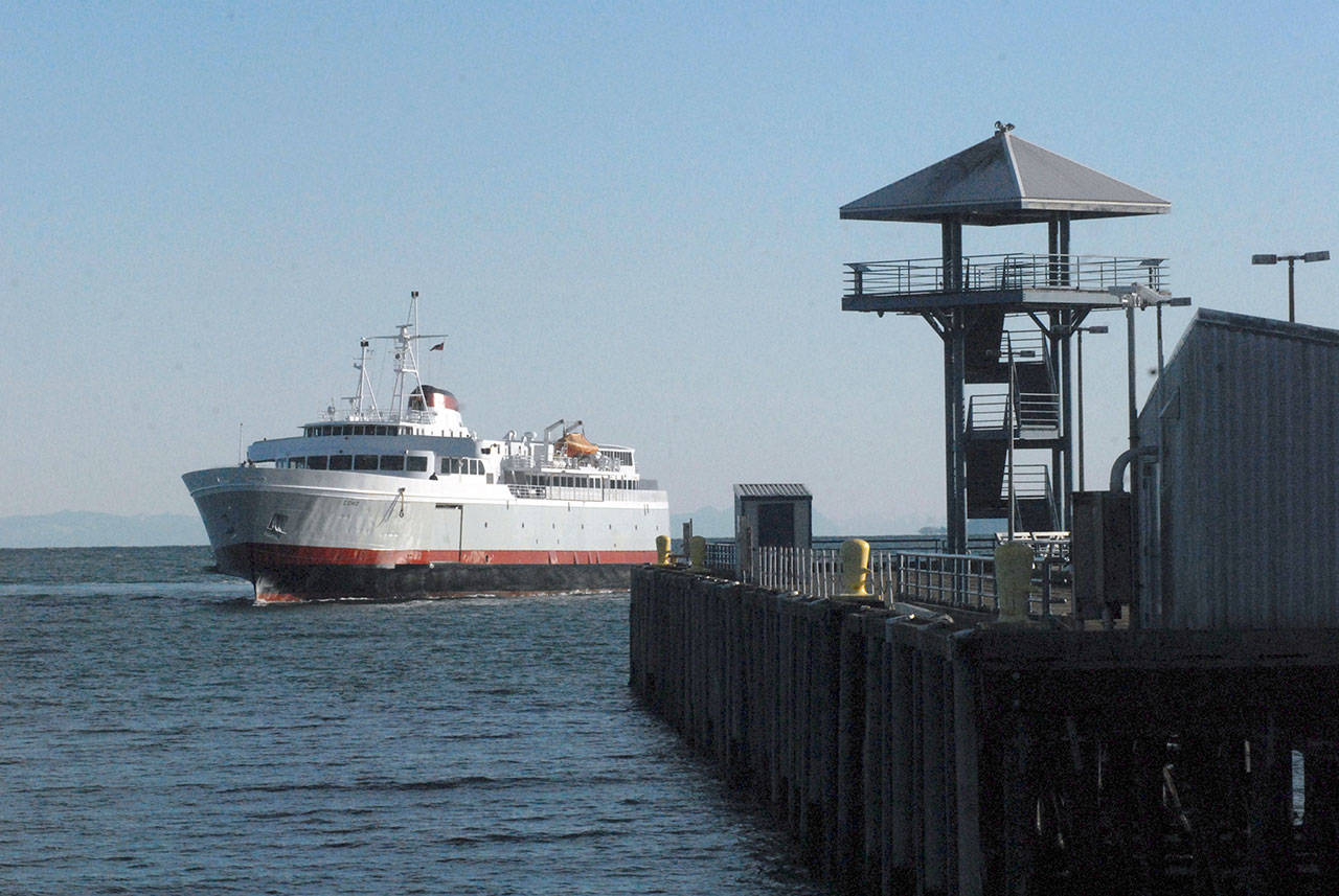 The ferry MV Coho sails past Port Angeles City Pier in February. The ferry will go to a three-round-trips schedule between Port Angeles and Victoria on Thursday. (Keith Thorpe/Peninsula Daily News)