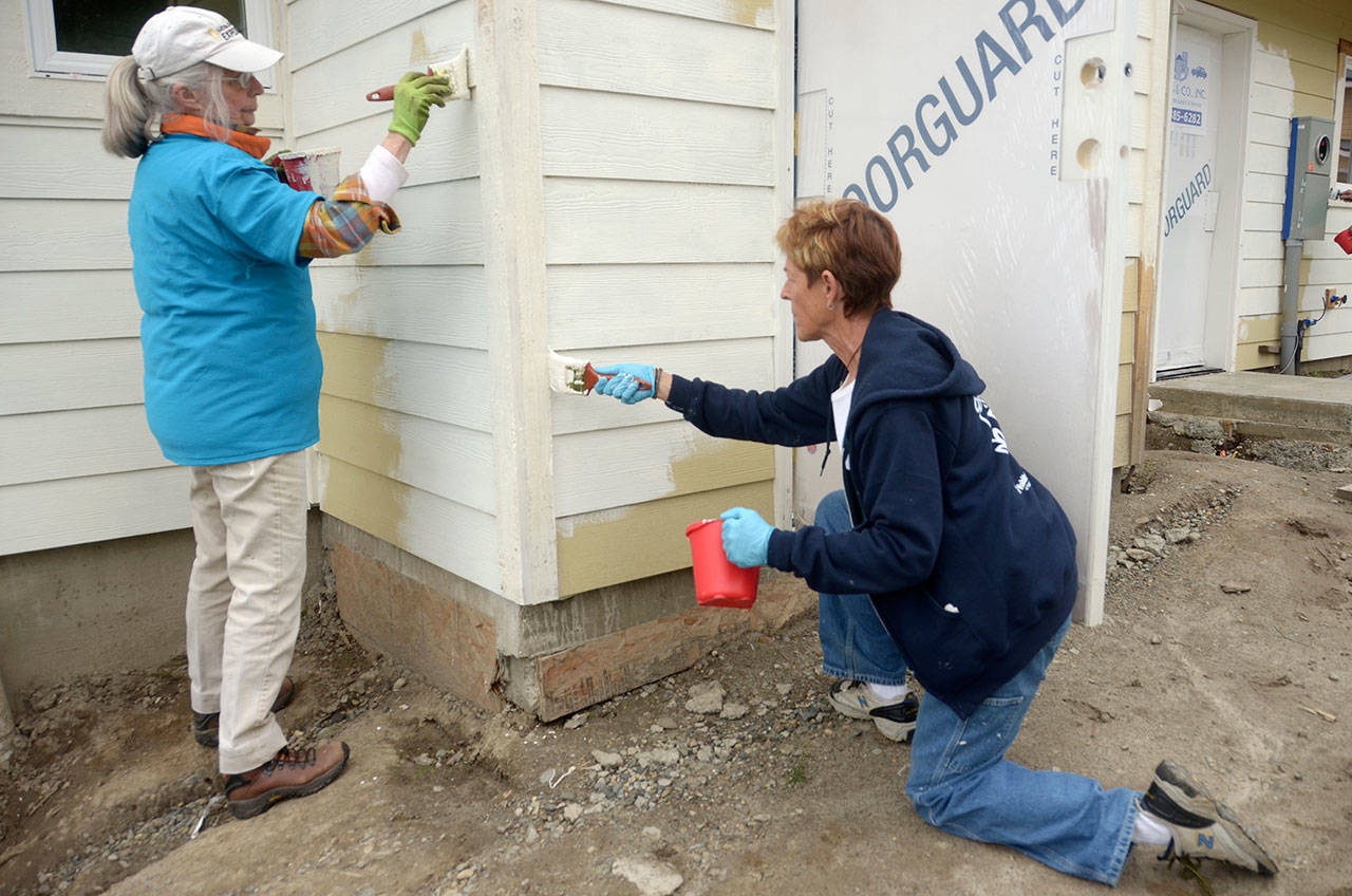 Nancy Wyatt and Kathi Boyker of Quilcene were two of almost 50 women who helped build Habitat for Humanity houses in Port Townsend for National Women Build Week. (Cydney McFarland/Peninsula Daily News)